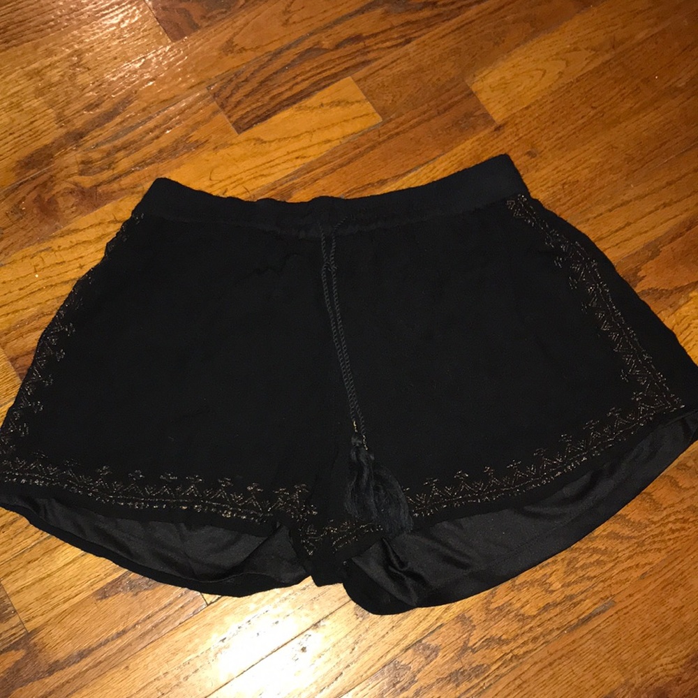 Black flowy shorts with gold embroidered design